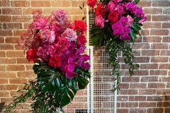 Floral stands with pink and red flowers