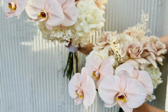 Pastel roses and orchid wedding bouquet 